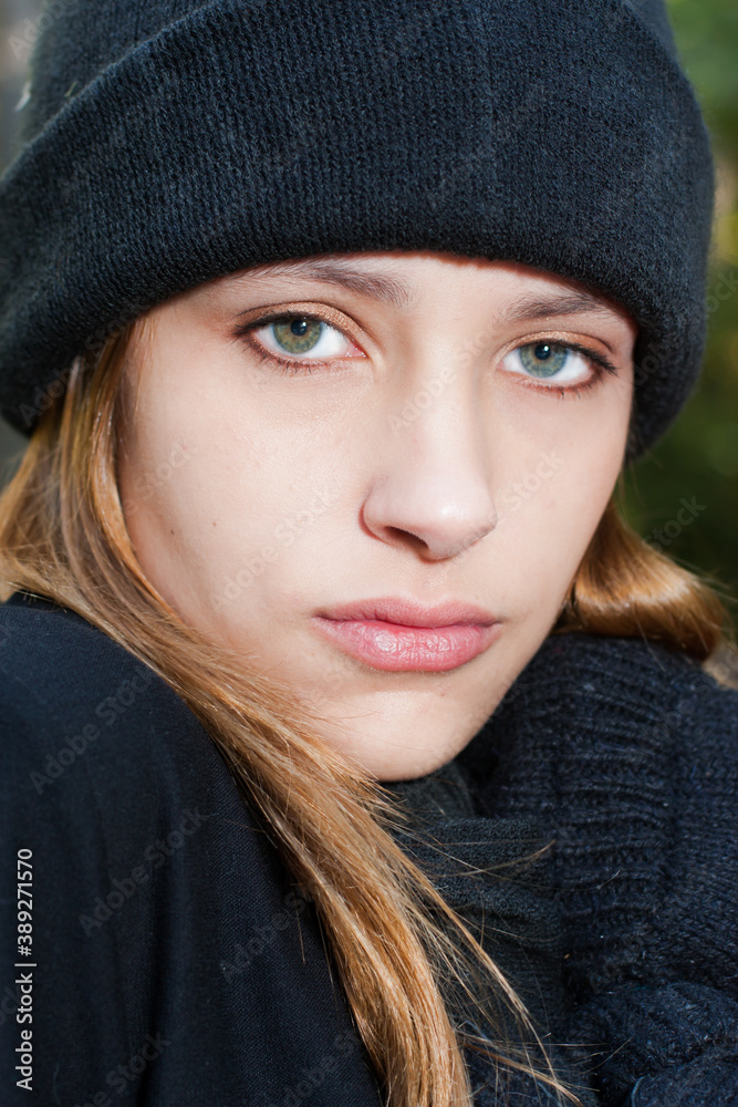 Young teen wearing winter mittens, scarf and hat Young teen wearing winter mittens, scarf and hat
