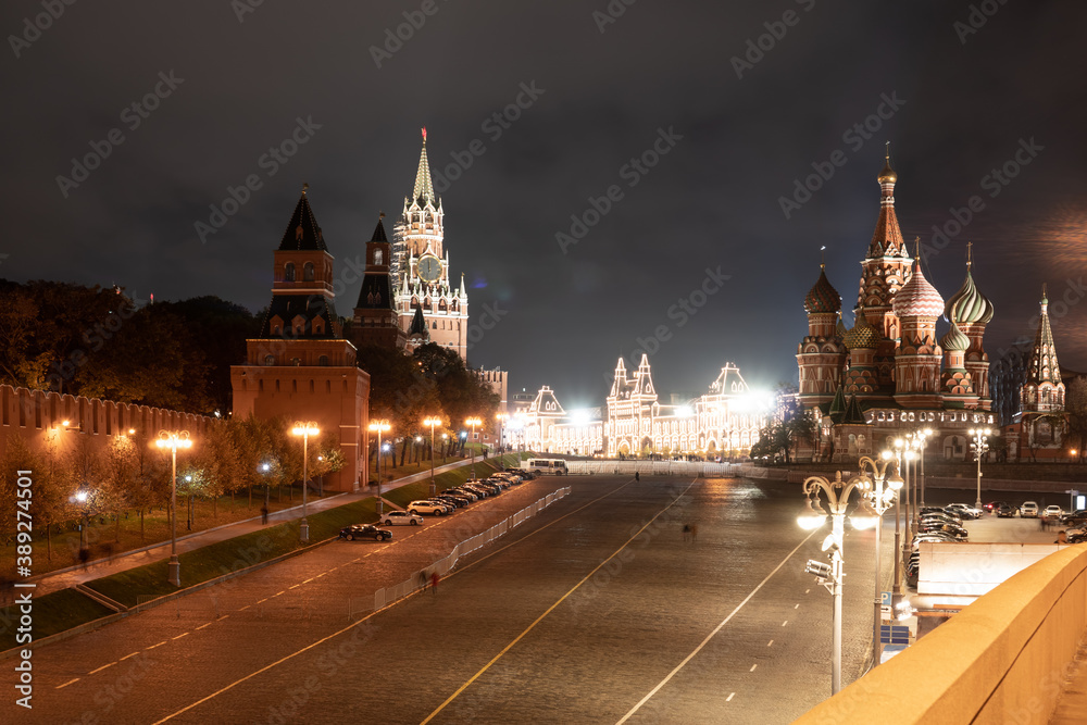 View on the Red Square. St. Basil's Cathedral and the Spasskaya Tower of the Moscow Kremlin with chimes.