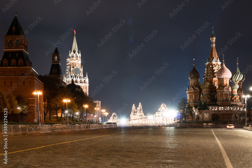 View on the Red Square. St. Basil's Cathedral and the Spasskaya Tower of the Moscow Kremlin with chimes.