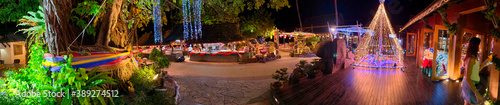 KOH PHI PHI, THAILAND - DECEMBER 24, 2019: Tourists along the beach at night for Christmas Eve