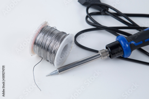 Solder for soldering with a soldering iron in a Bay on a white background. photo