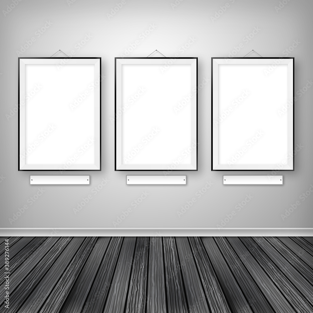 Gallery interior with three empty frames on wall. Gallery interior with three empty frames on wall.