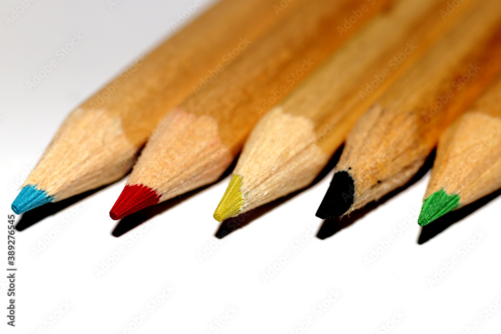 Wooden Crayons on a white background - close up Wooden Crayons on a white background - close up