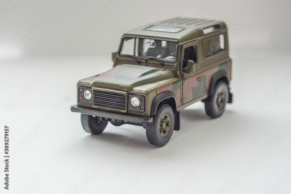 military camo-colored toy car. All-terrain military car waiting for soldiers.