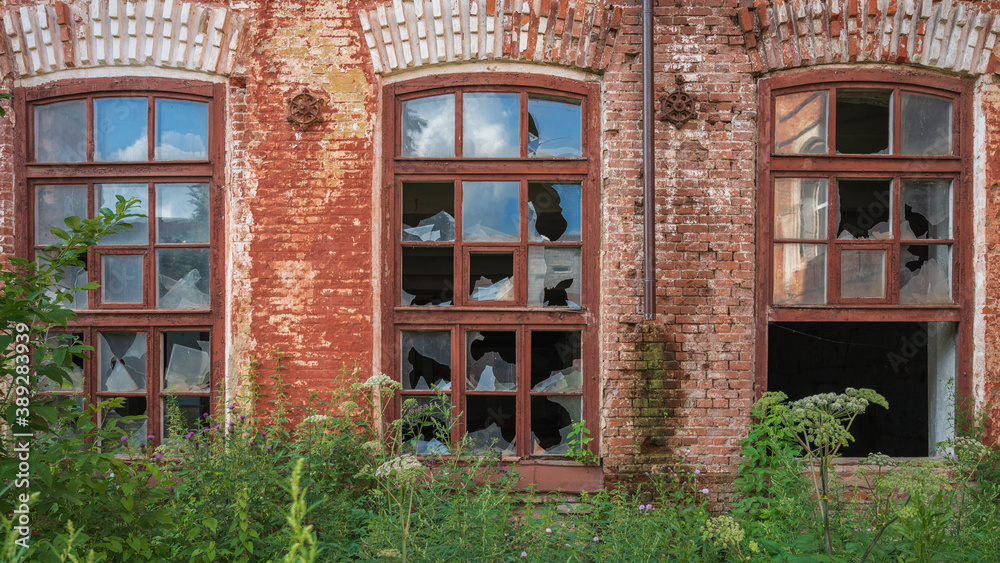 broken Windows of an old red brick building. broken Windows of an old red brick building.