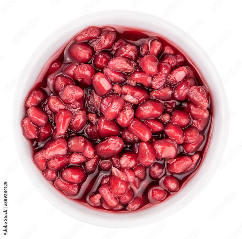 preserved Pomegranate seeds isolated on white background (selective focus; close-up shot) preserved Pomegranate seeds isolated on white background (selective focus; close-up shot)