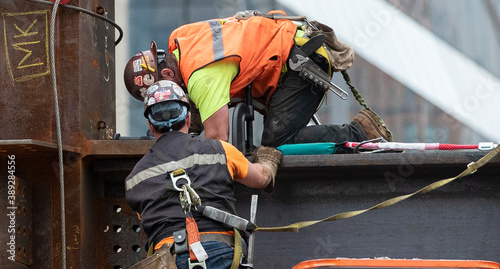 2 Steel framers at work on the erecting of a hi-rise building in Manhattanâ€™s Hudson Yards development photo