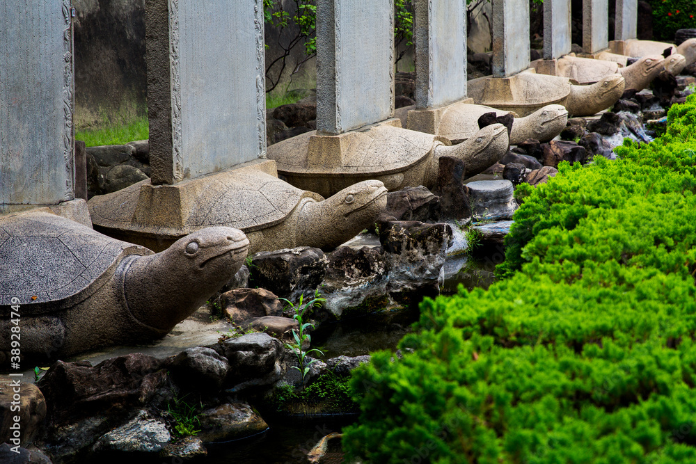 Tainan, Taiwan, Asia, October 12, 2019 Traditional Chinese style sculpture in the Park by the stream