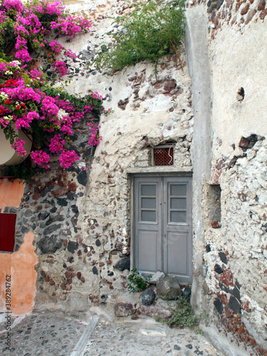 Magic Oia, Sanorini island Greece. Views of the historical part of the city of Oia. Streets and houses of the old city. photo