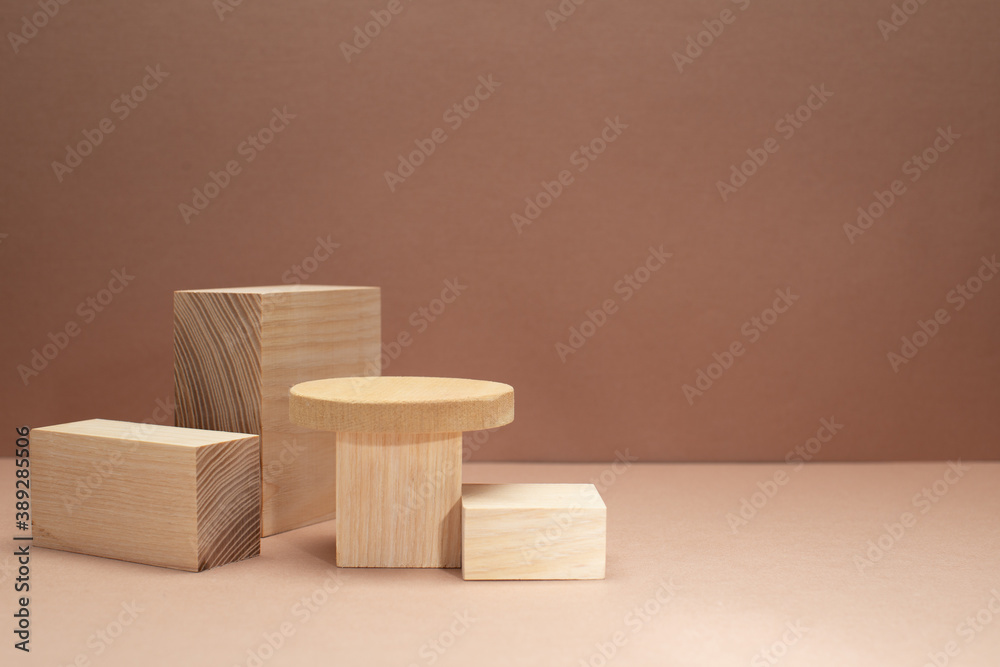 Conceptual Background with light wooden podiums and wooden ball on beige background for branding,identity and packing presentation of your product. Trendy still life on monotone tones.