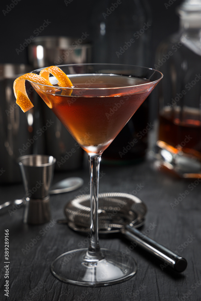 Manhattan cocktail with an orange twist as a garnish Manhattan cocktail with an orange twist as a garnish