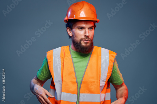 A man in a working uniform a professional construction close-up