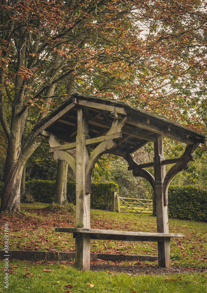 Wooden bench in the park, autumn colors,  Ironbridge, England, Europe