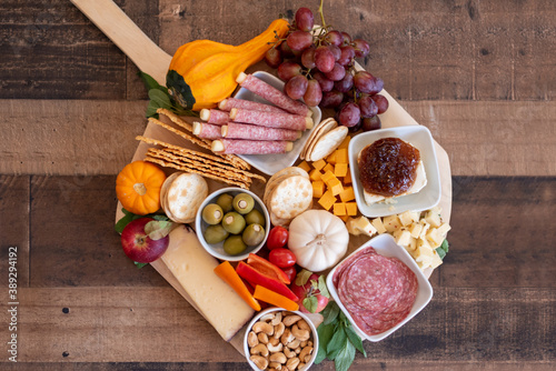 Fotografie Top view of autumn theme charcuterie board