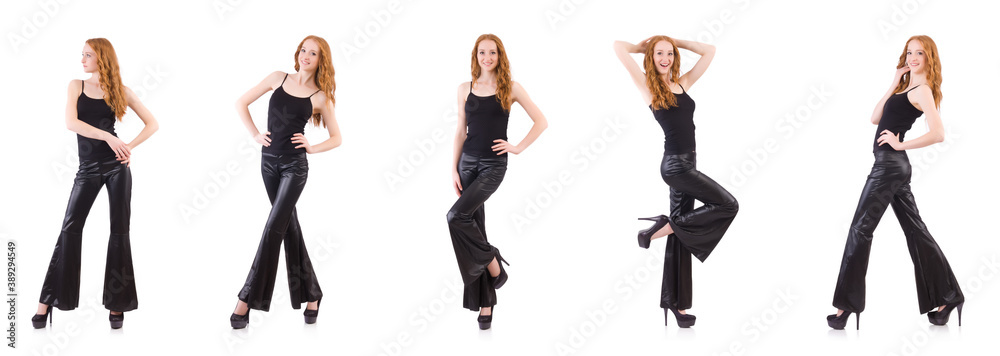 Fototapeta premium Redhead woman in black bell bottom pants on white
