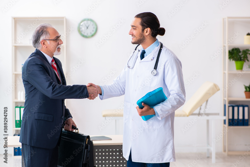 Male doctor and businessman discussing medical project Male doctor and businessman discussing medical project