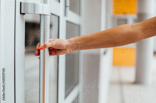 The girl opens the door with wet wipes.