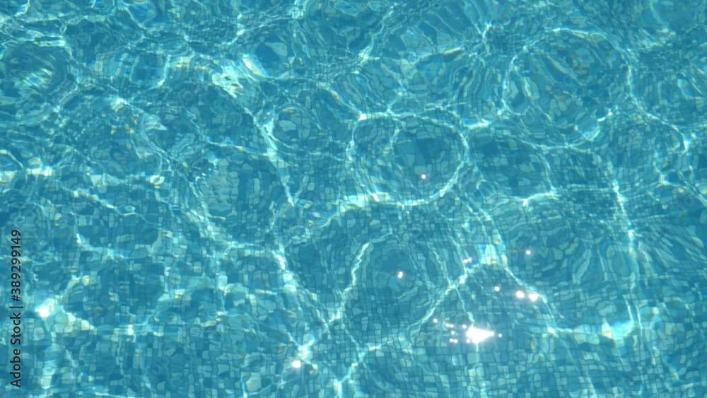 Arty waves coming up and down in a wading pool on sunny day in summer Arty waves coming up and down in a wading pool on sunny day in summer
