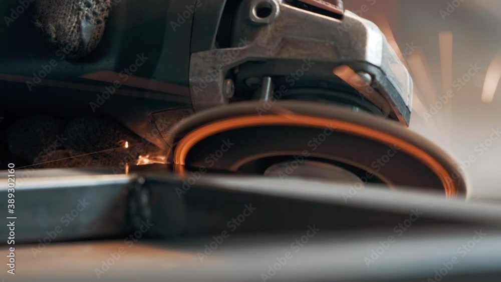 Saws metal with a circular saw, many sparks. The working process. Macro view. 4k Saws metal with a circular saw, many sparks. The working process. Macro view. 4k