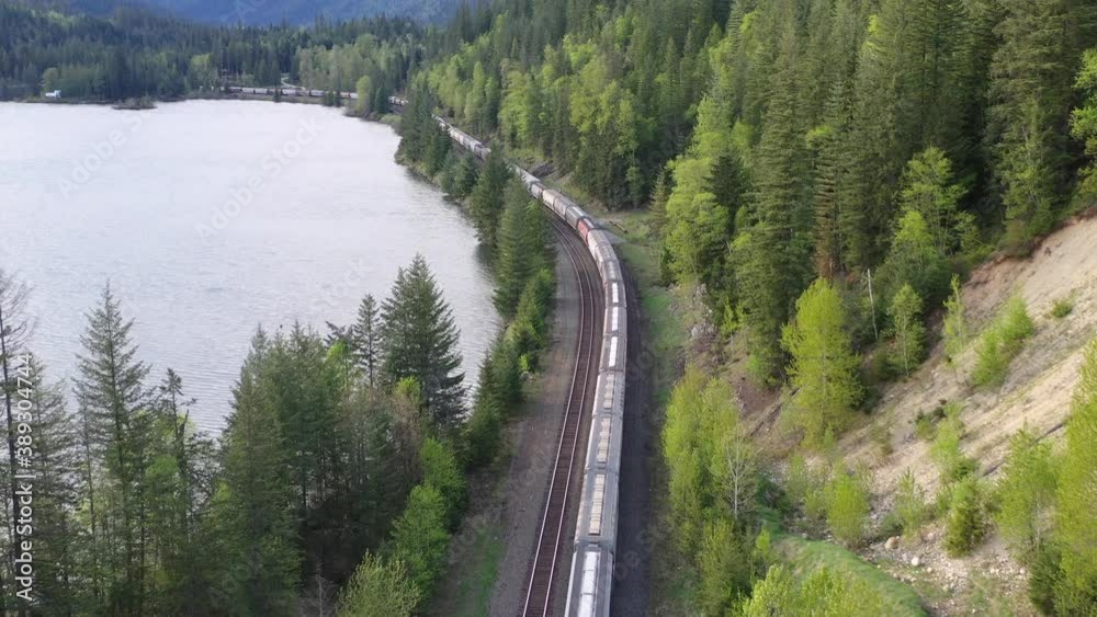 Aerial view of a freight train passing through stunning landscape
Aerial view of a freight train passing through stunning landscape