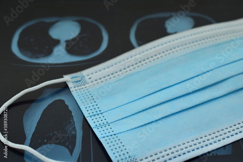 Medical mask and CT scan of the lungs. Closeup.