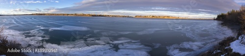 Panoramic Landscape Scenery of Glenmore Reservoir in South Calgary  Alberta with Lake surface water half frozen on a beautiful October Autumn Afternoon 