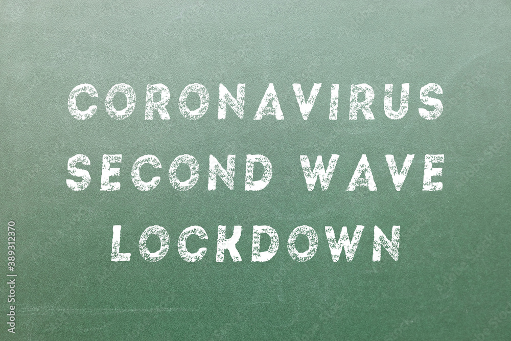 Obraz premium Coronavirus Second Wave Lockdown text on a green board