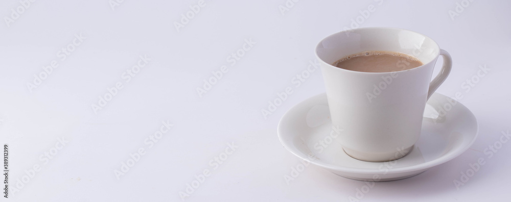 Coffee in a white mug on a white background. Copy space. Coffee in a white mug on a white background. Copy space.