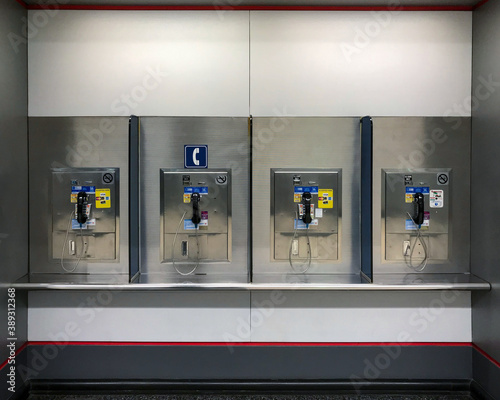 Public phone booth with multiple phones at an airport