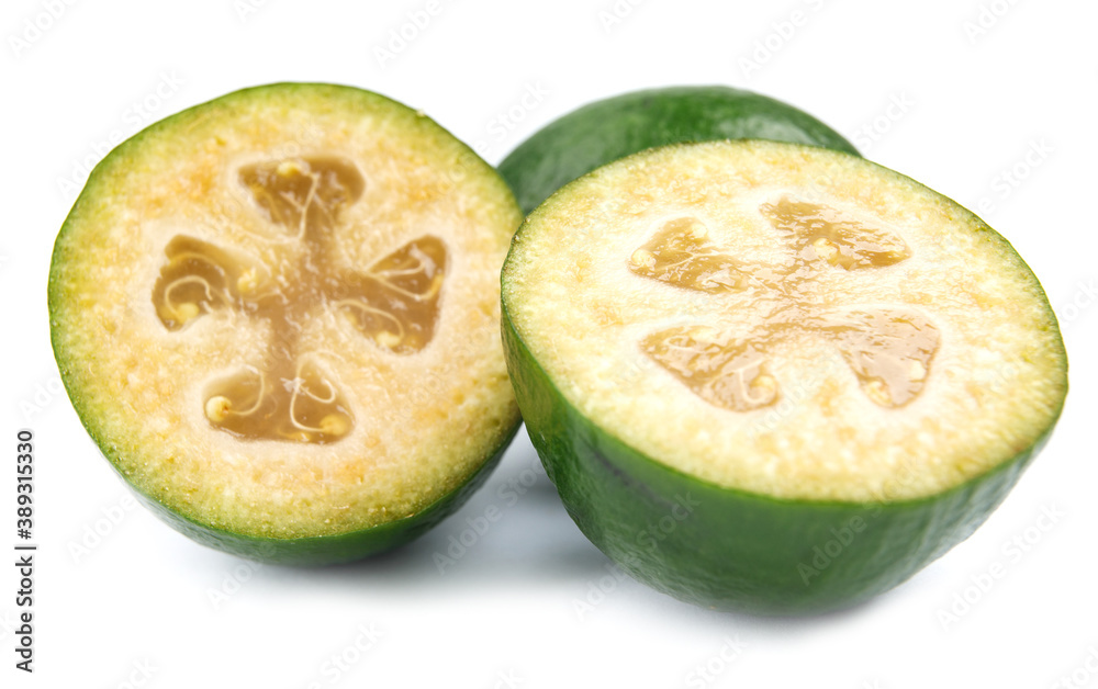Fresh green feijoa on a white background, isolated. Tropical fruit feijoa whole and half Fresh green feijoa on a white background, isolated. Tropical fruit feijoa whole and half