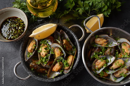 Classic French meal Moules marinière  Marinara mussels with garlic, sauce, lemon and parsley. 