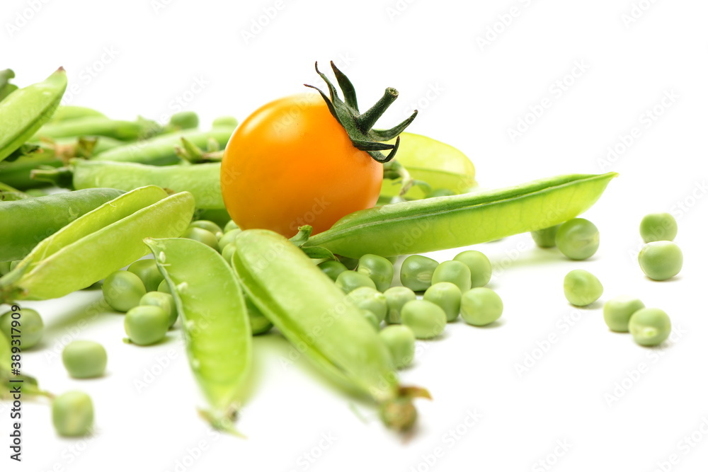 Fresh peas and cherry tomatoes isolated on white background