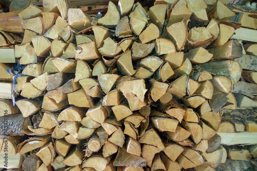 A woodpile of firewood is prepared for several years in advance A woodpile of firewood is prepared for several years in advance