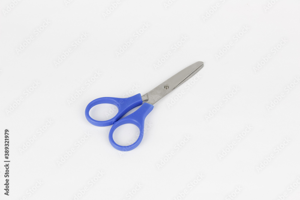 A blue used a scissor at the white background A blue used a scissor at the white background