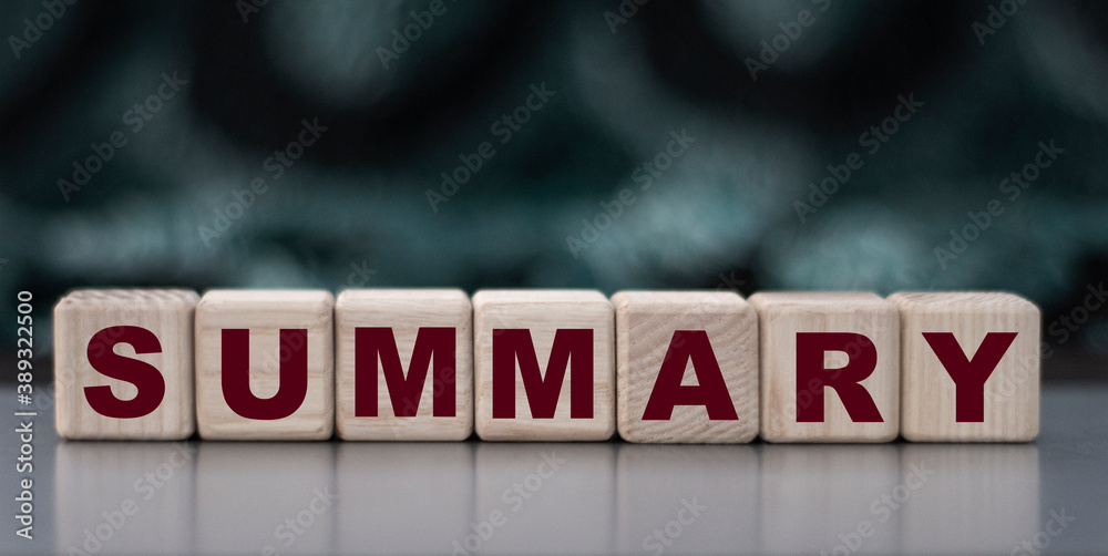 Obraz premium SUMMARY - word on wooden cubes on blurred camouflage background