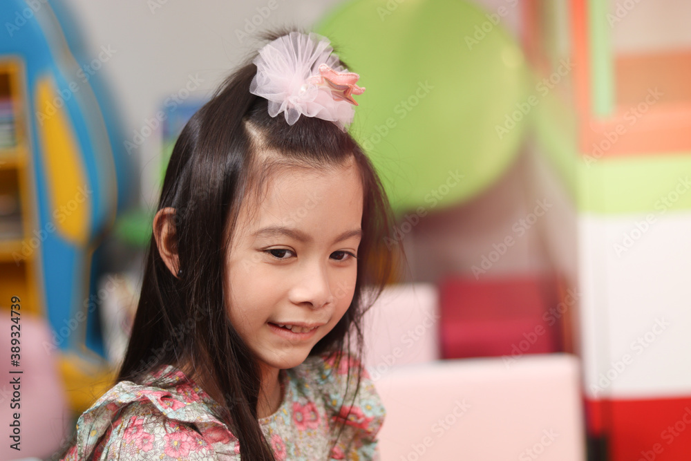 Portrait of smiling young beautiful girl at playground, kid having fun and playing with friend Portrait of smiling young beautiful girl at playground, kid having fun and playing with friend