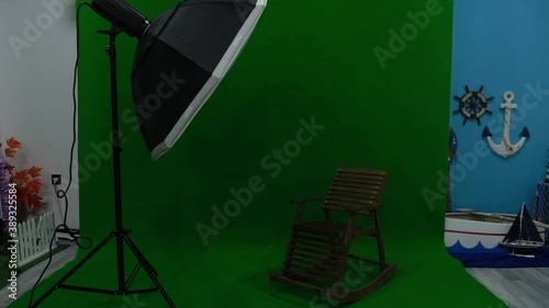 Photo or video studio with two hexagone studio lights. Green screen and fixed chair