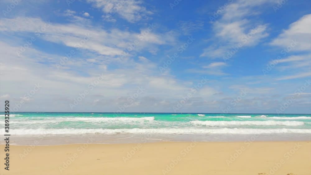 Beautiful deep blue sea water & calm ocean wave crashing tropical summer sandy seashore or coastline on sunny clear sky with white clouds at Phuket Karon beach Thailand, 4K UHD nature landscape view Beautiful deep blue sea water & calm ocean wave crashing tropical summer sandy seashore or coastline on sunny clear sky with white clouds at Phuket Karon beach Thailand, 4K UHD nature landscape view