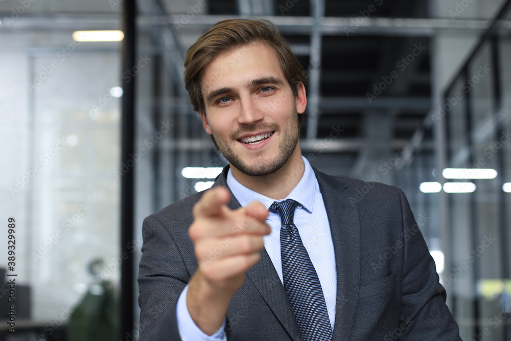 Confident businessman looking at camera talking about company strategy and business plan, explaining corporate success. Confident businessman looking at camera talking about company strategy and business plan, explaining corporate success.