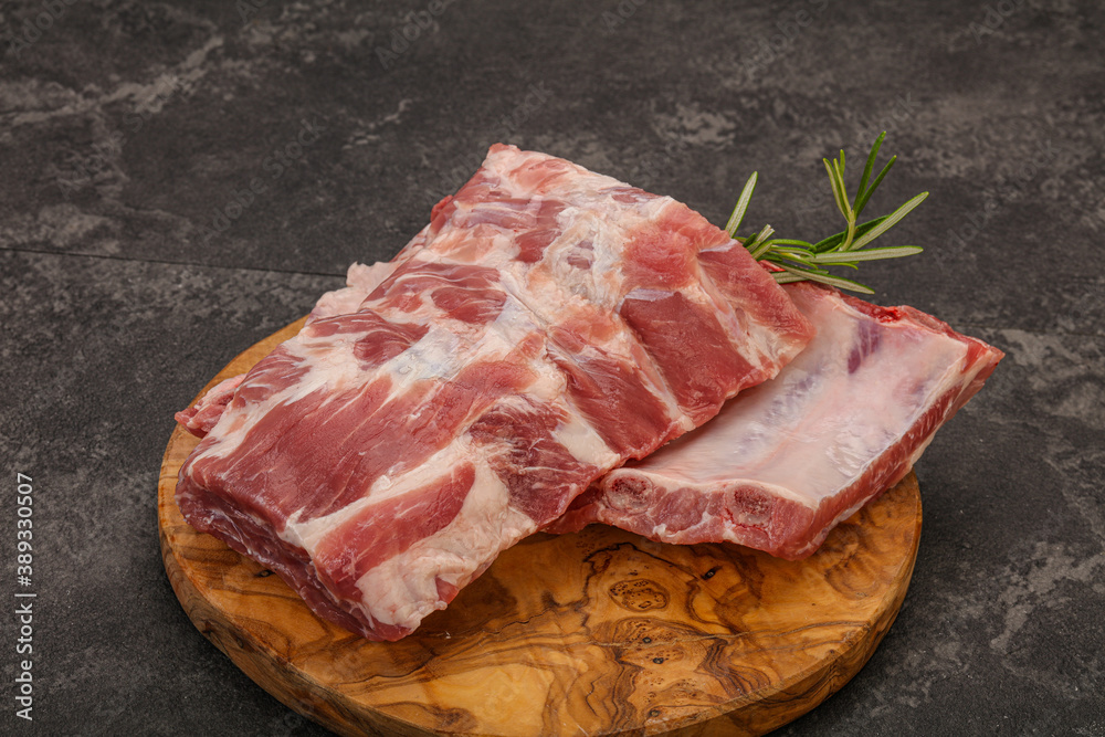 Raw pork ribs served rosemary Raw pork ribs served rosemary