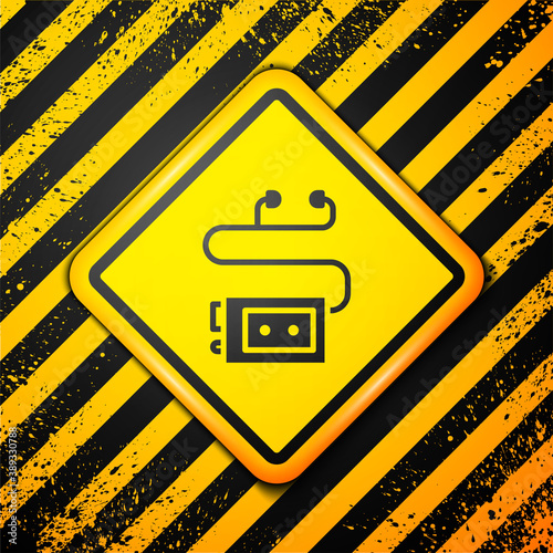 Black Museum audio guide icon isolated on yellow background. Headphones for excursions. Warning sign. Vector.