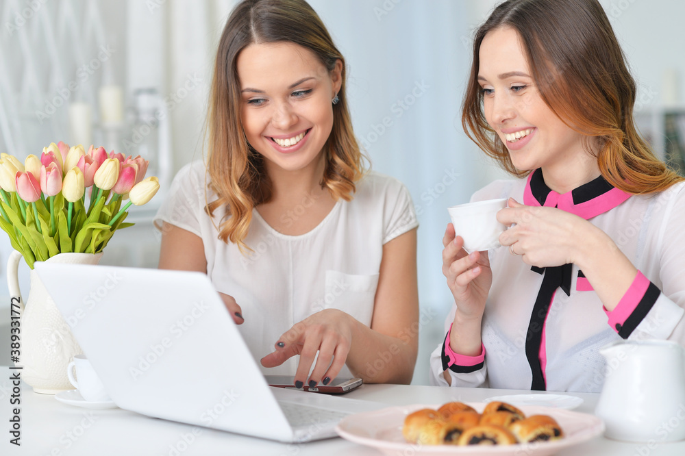 Portrait of two female friends at desk Portrait of two female friends at desk