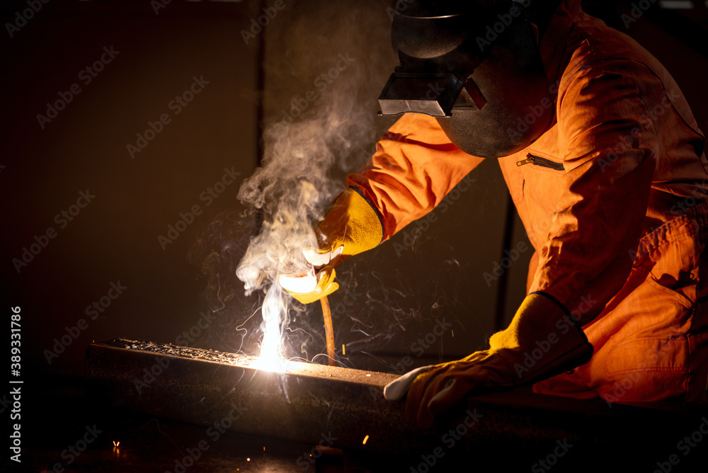 Metal industry workers are welding steel sheets for real estate projects received. Metal industry workers are welding steel sheets for real estate projects received.