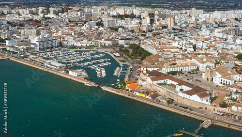 Aerial view of the city of Faro at the beautiful Algarve coast, in Portugal seen on a flight to Faro