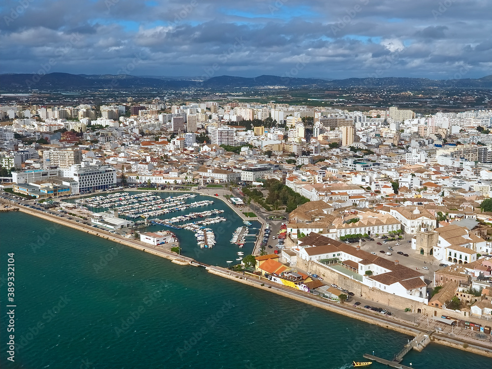Aerial view of the city of Faro at the beautiful Algarve coast, in Portugal seen on a flight to Faro