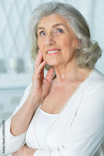 Close-up portrait of beautiful smiling senior woman