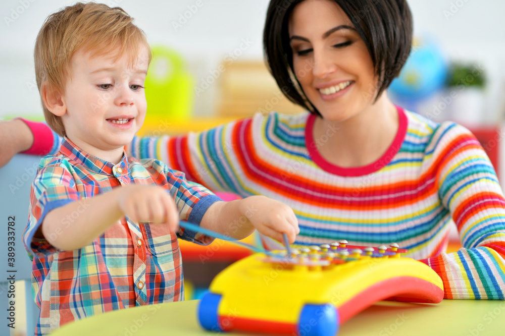 Young mother and cute little son playing Young mother and cute little son playing