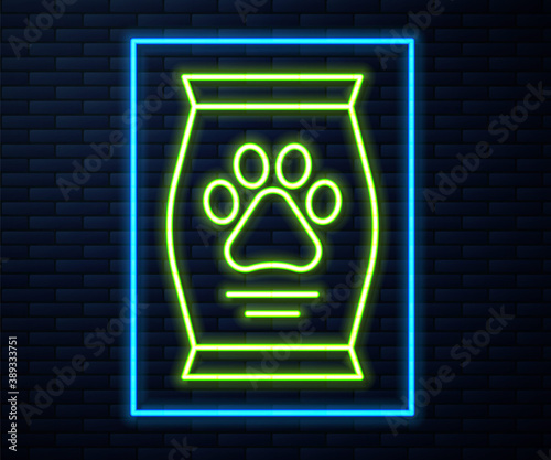 Glowing neon line Bag of food for dog icon isolated on brick wall background. Dog or cat paw print. Food for animals. Pet food package. Vector.