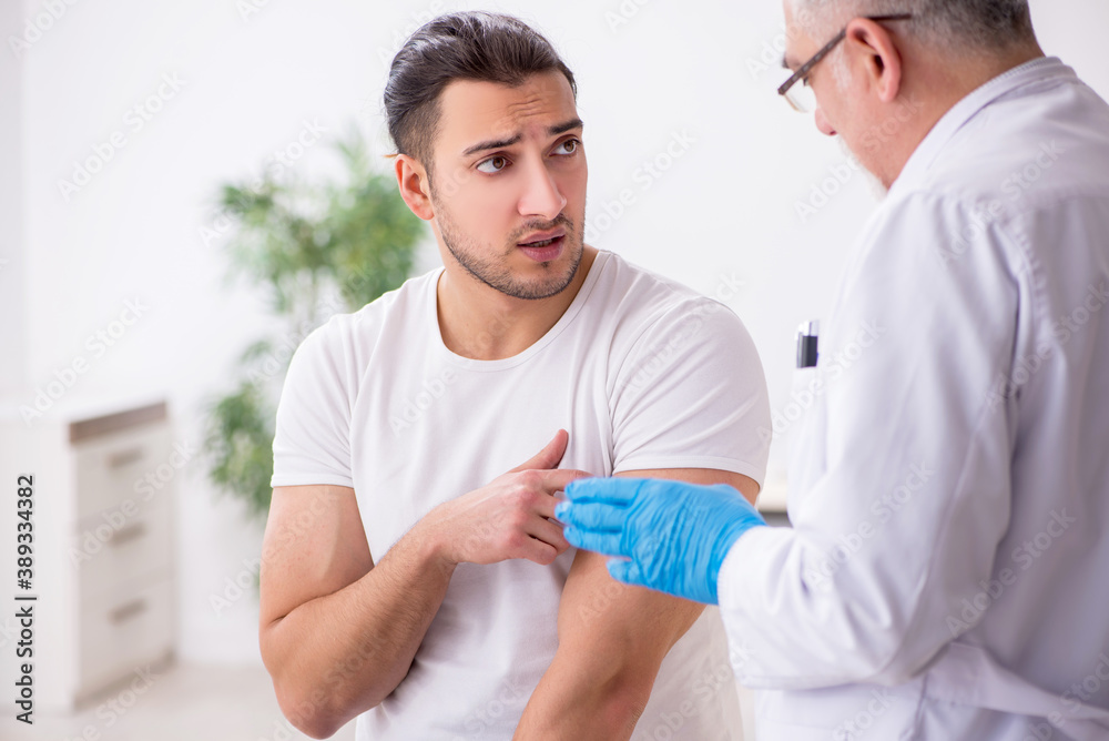Young man visiting experienced doctor dermatologist Young man visiting experienced doctor dermatologist