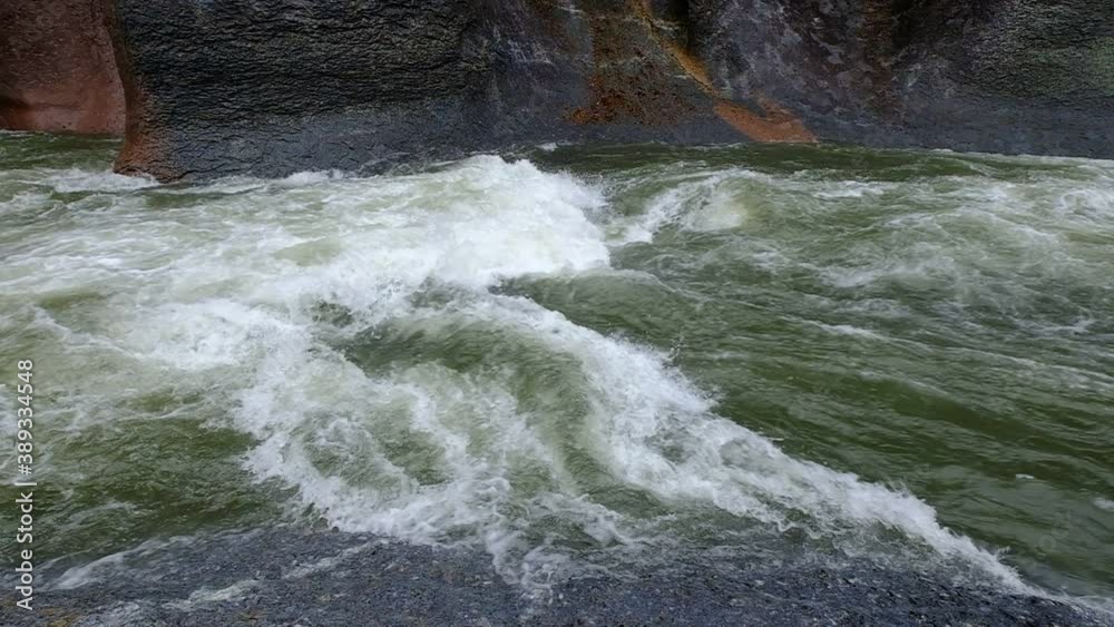 A slow motion of a water stream that flows noisily in a large rocky environment, Fukiware Falls, next to Numata, near Nikko National Park, Japan. A slow motion of a water stream that flows noisily in a large rocky environment, Fukiware Falls, next to Numata, near Nikko National Park, Japan.